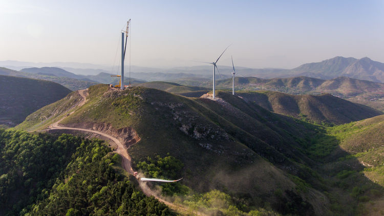 Wind blade adapter trailer on a mountainous road